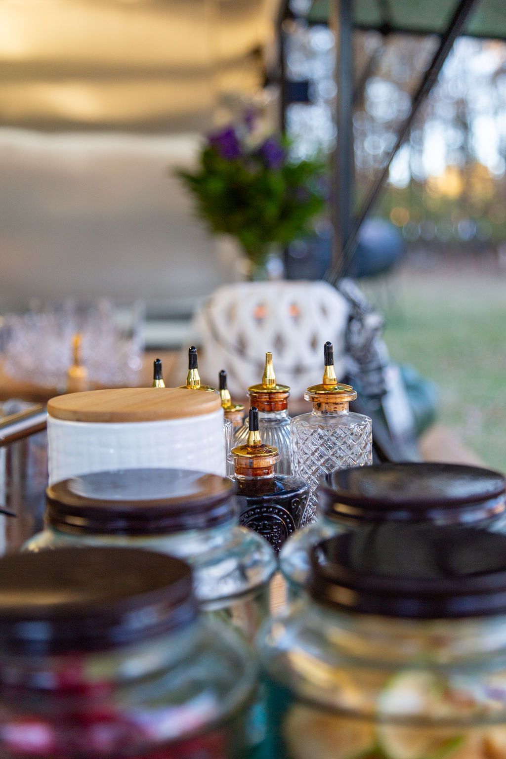 A bunch of jars sitting on top of a table.