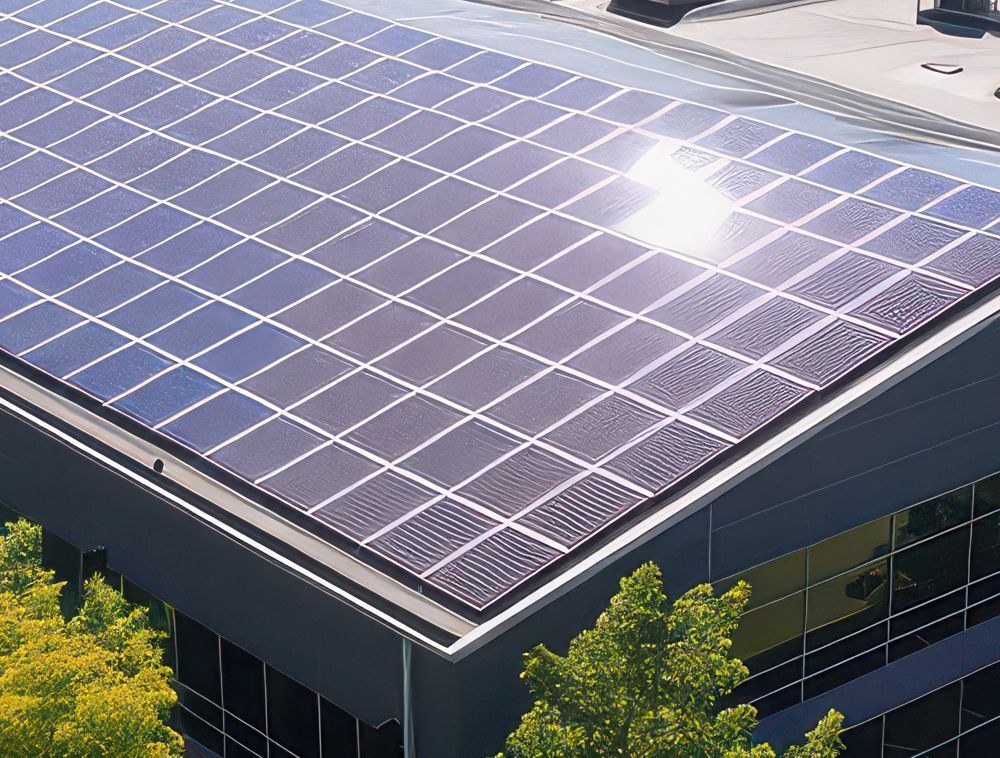 Solar panels covering a modern building rooftop in bright sunlight.