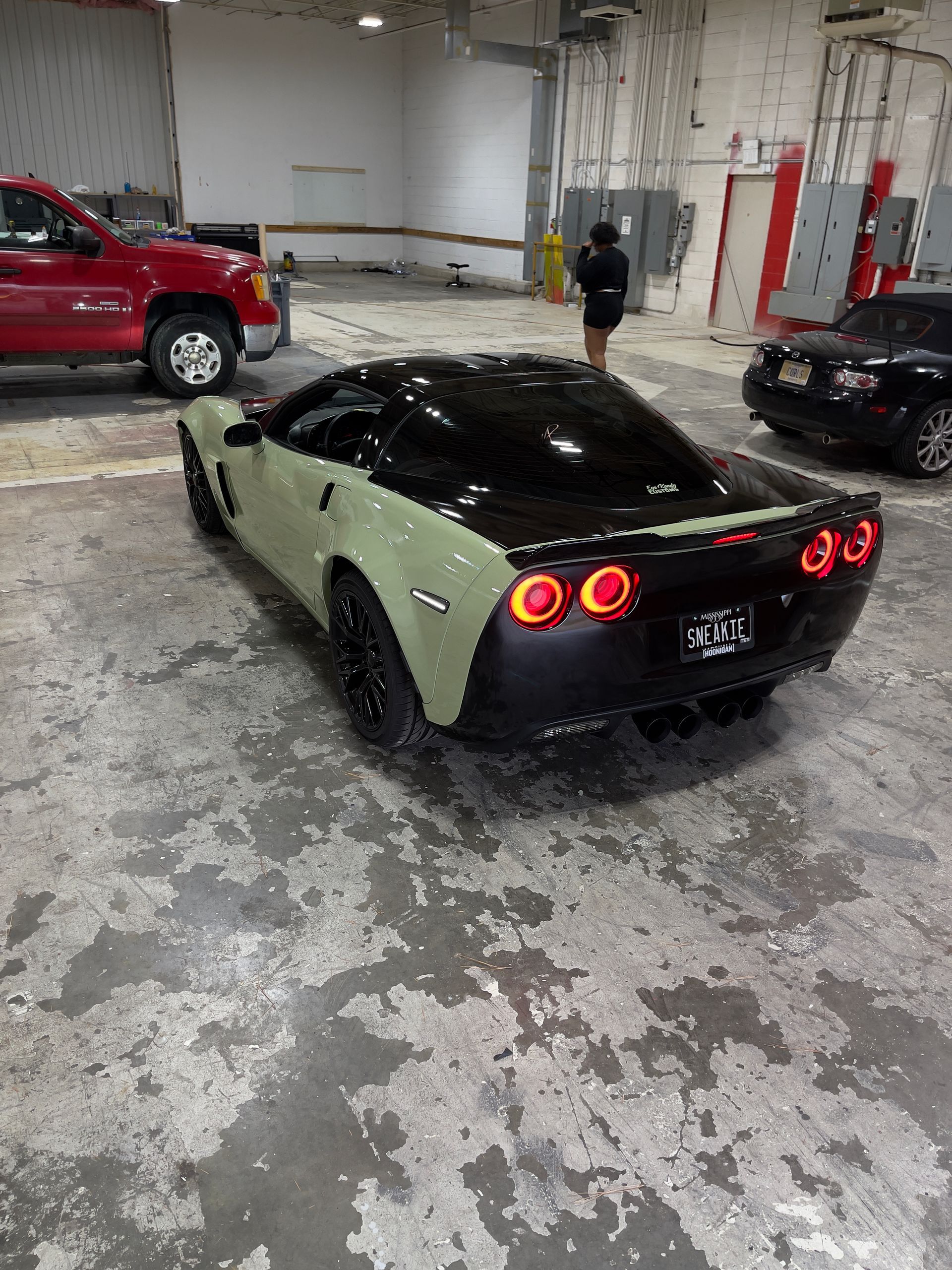 Rear view of satin sage wrapped Corvette