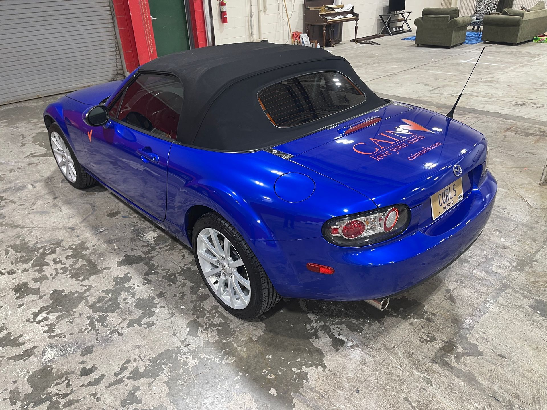Completed automotive window tint on a blue vehicle