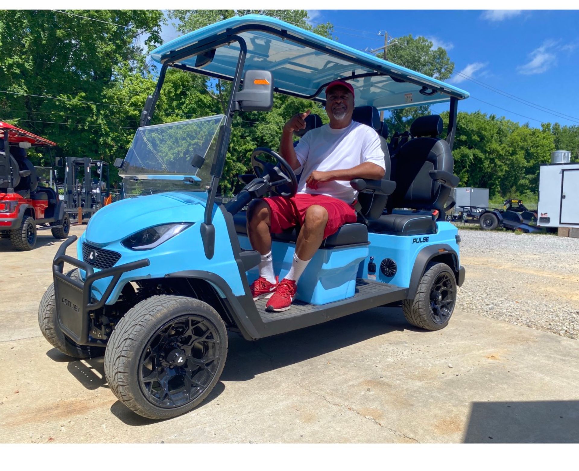 Ricky Allen with his new baby blue golf cart before the wrap