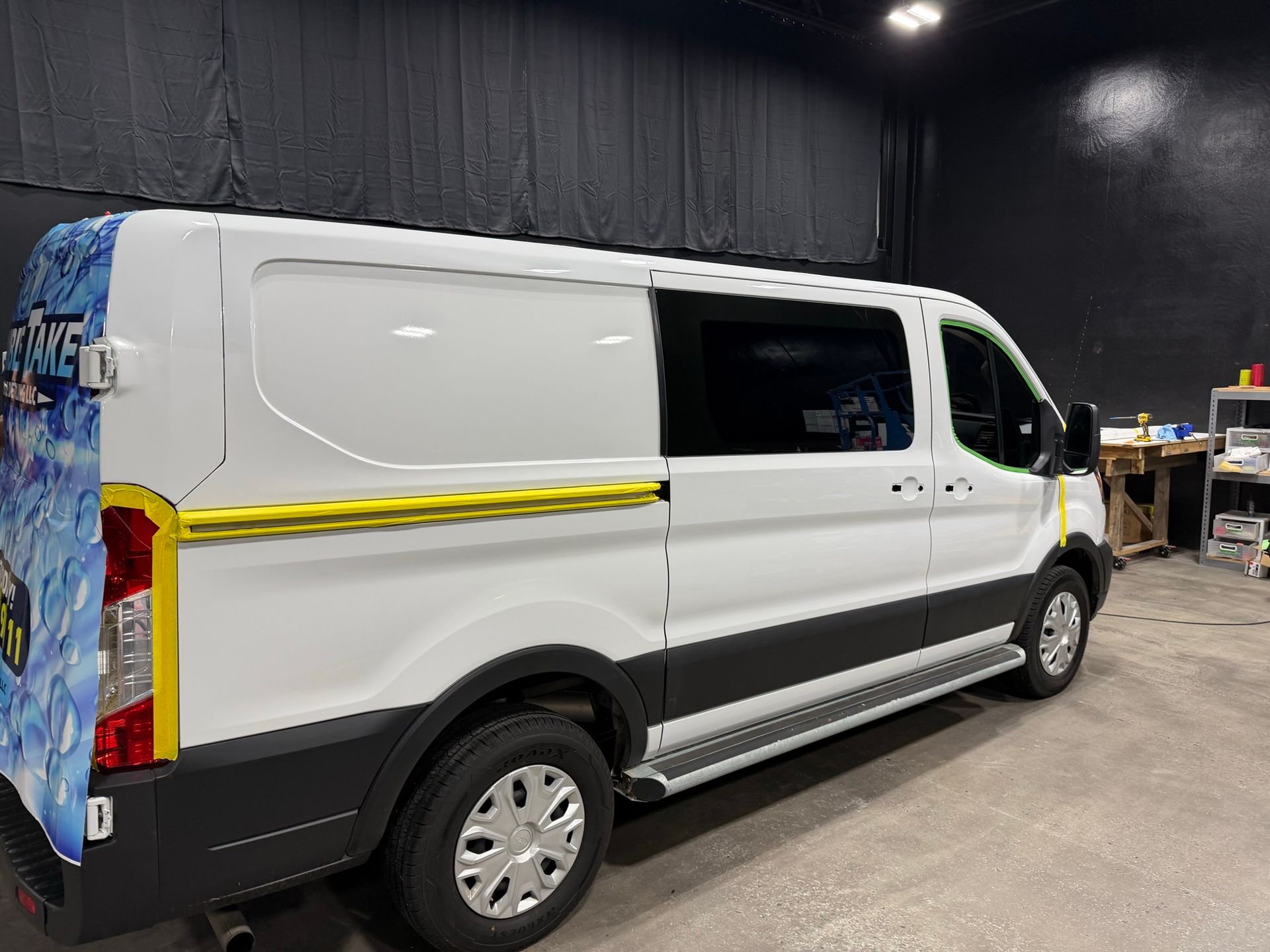 Double Take van wrap in progress on the rear panel
