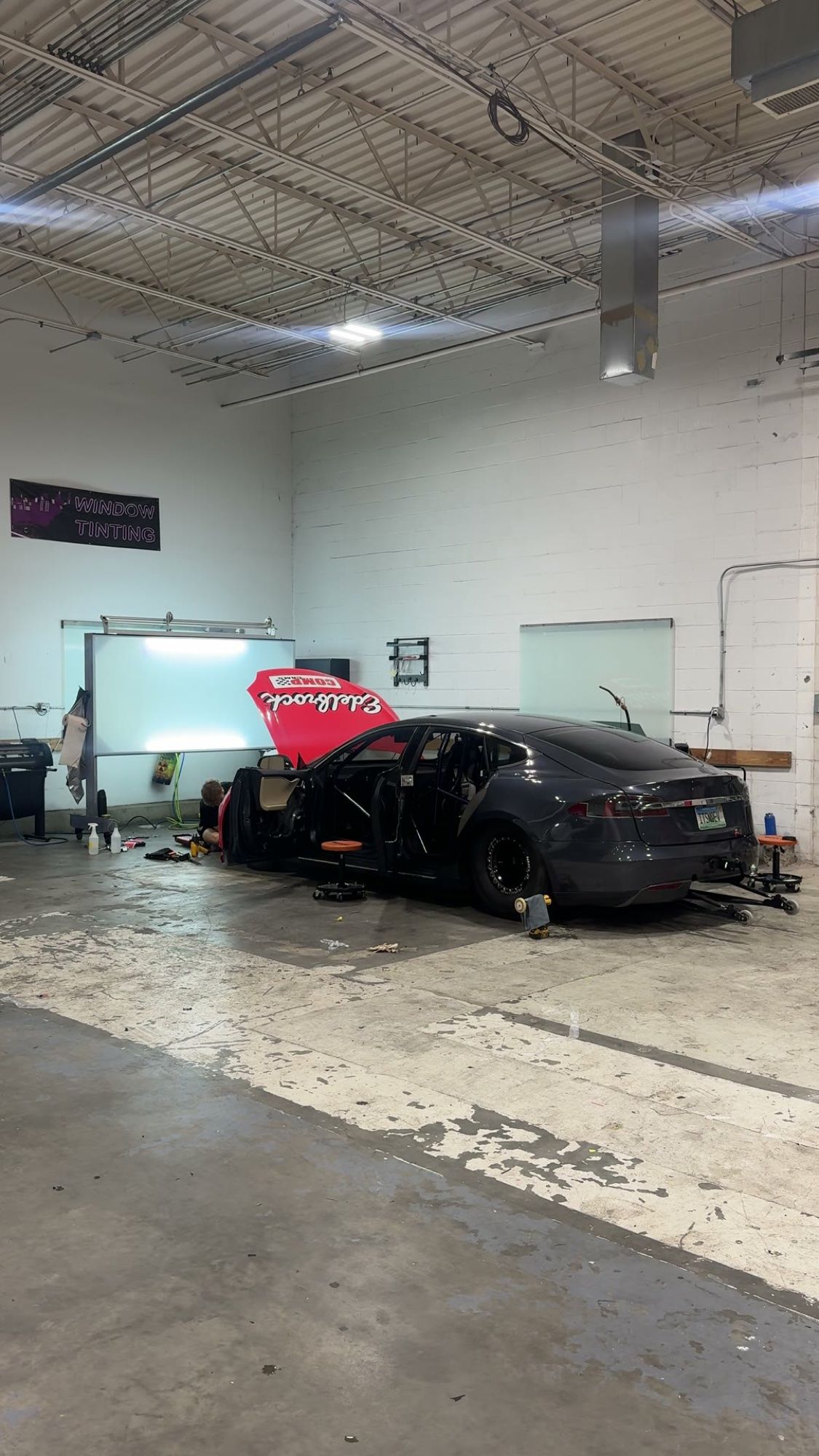 Edelbrock Tesla Model S prepped in the Eye Kandy Customs shop before the wrap