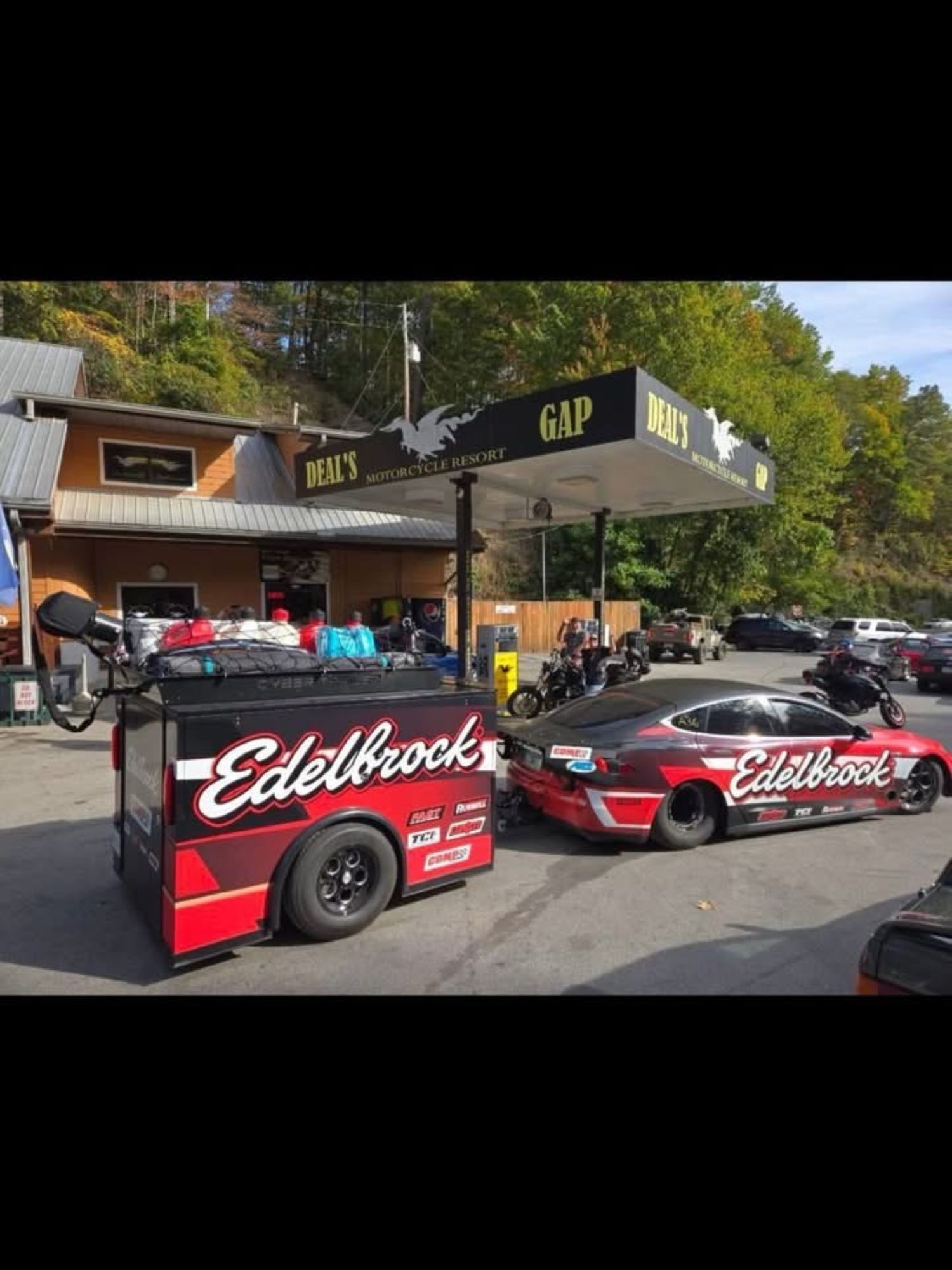 Edelbrock Tesla and trailer on a road trip stop