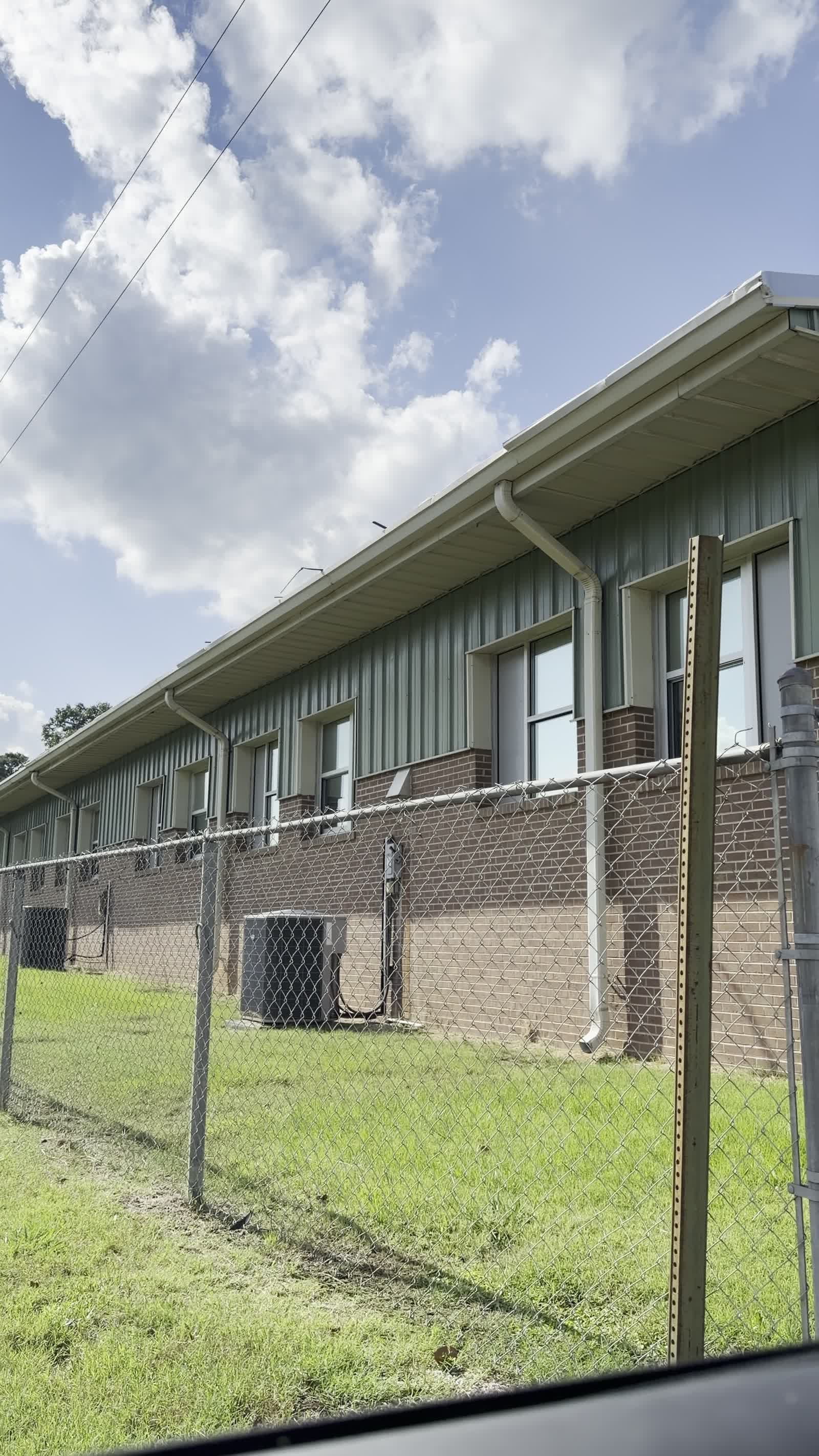 Side view of H.W. Byers School showing rows of tinted classroom windows