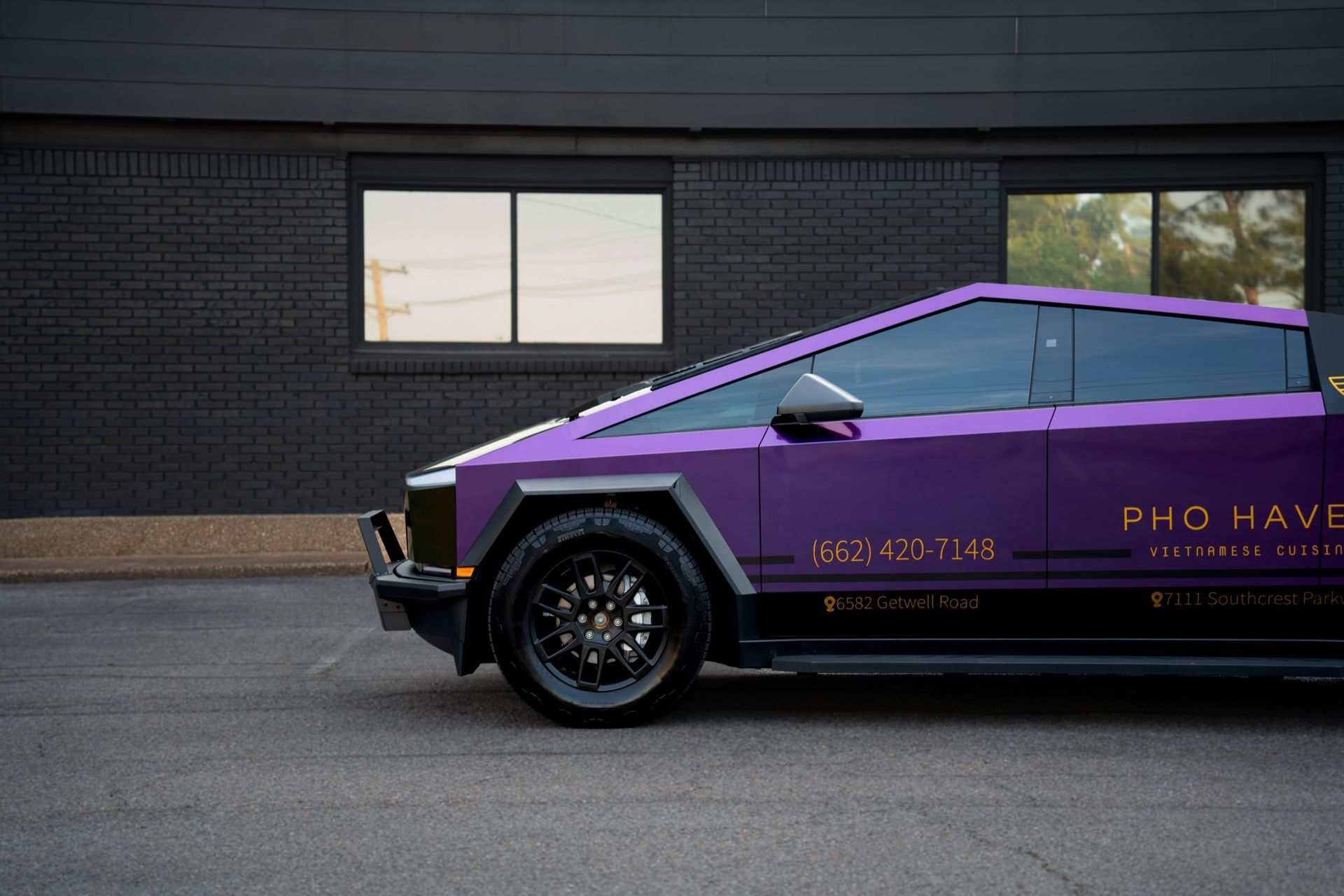 Pho Haven Tesla Cybertruck in TeckWrap Crazy Grape color shift wrap with gold chrome graphics