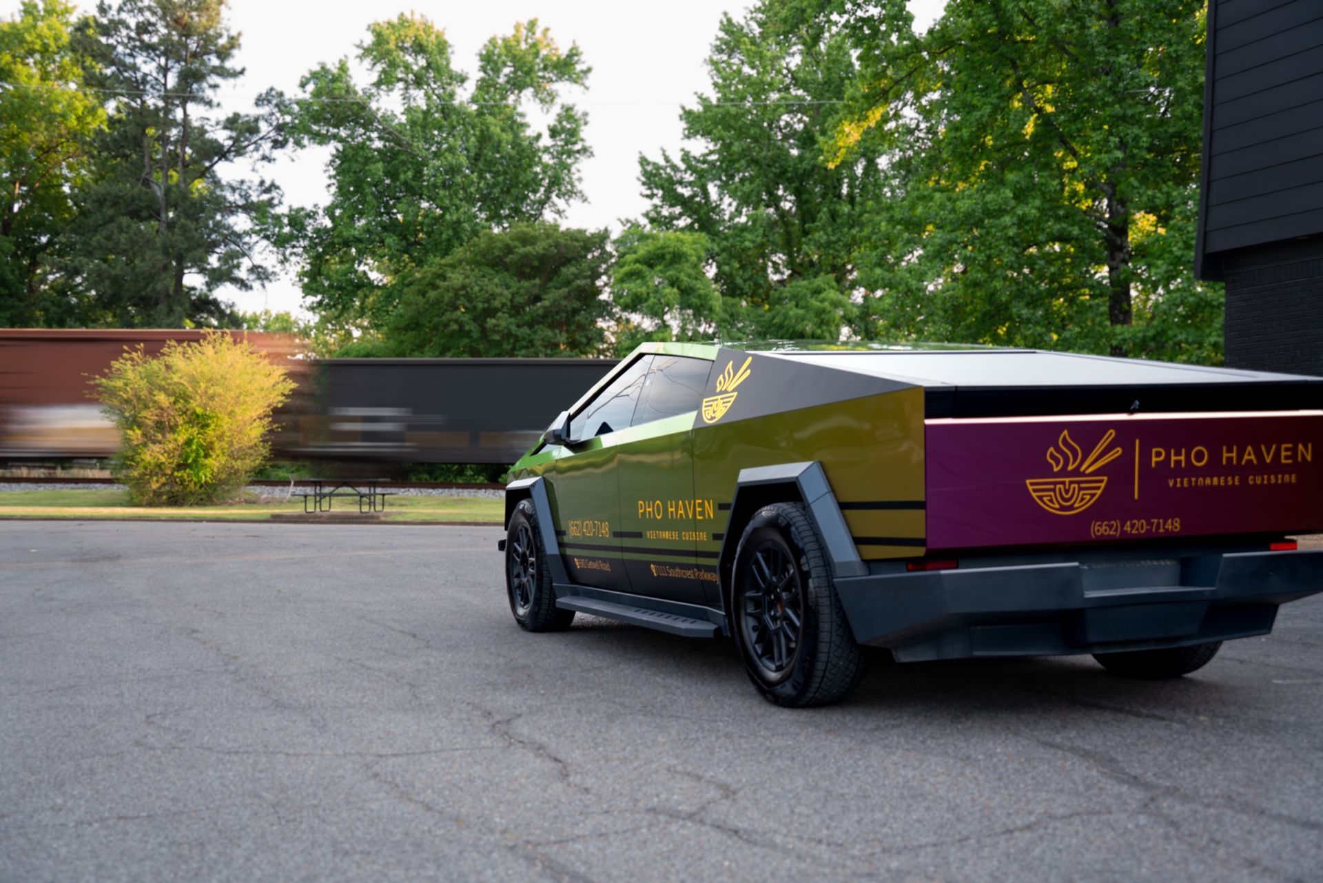 Pho Haven Cybertruck tailgate with gold chrome logo and matte black accents
