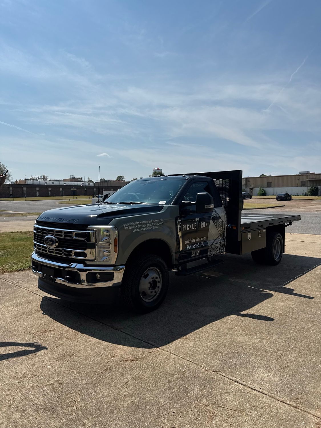 Pickle Iron Ford Super Duty flatbed with fleet wrap and ceramic tint by Eye Kandy Customs