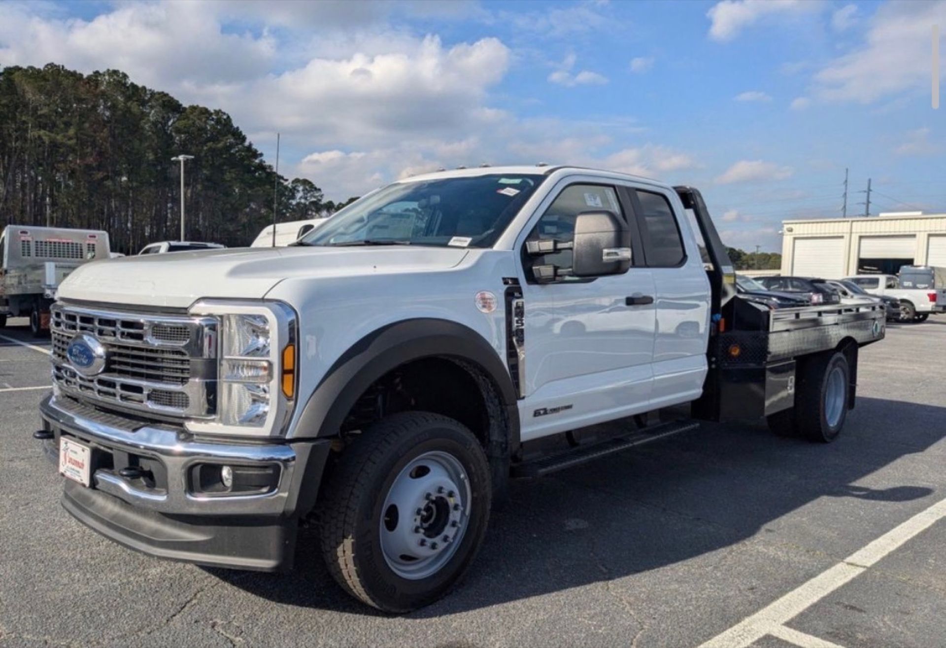 White Ford Super Duty flatbed before the Pickle Iron wrap