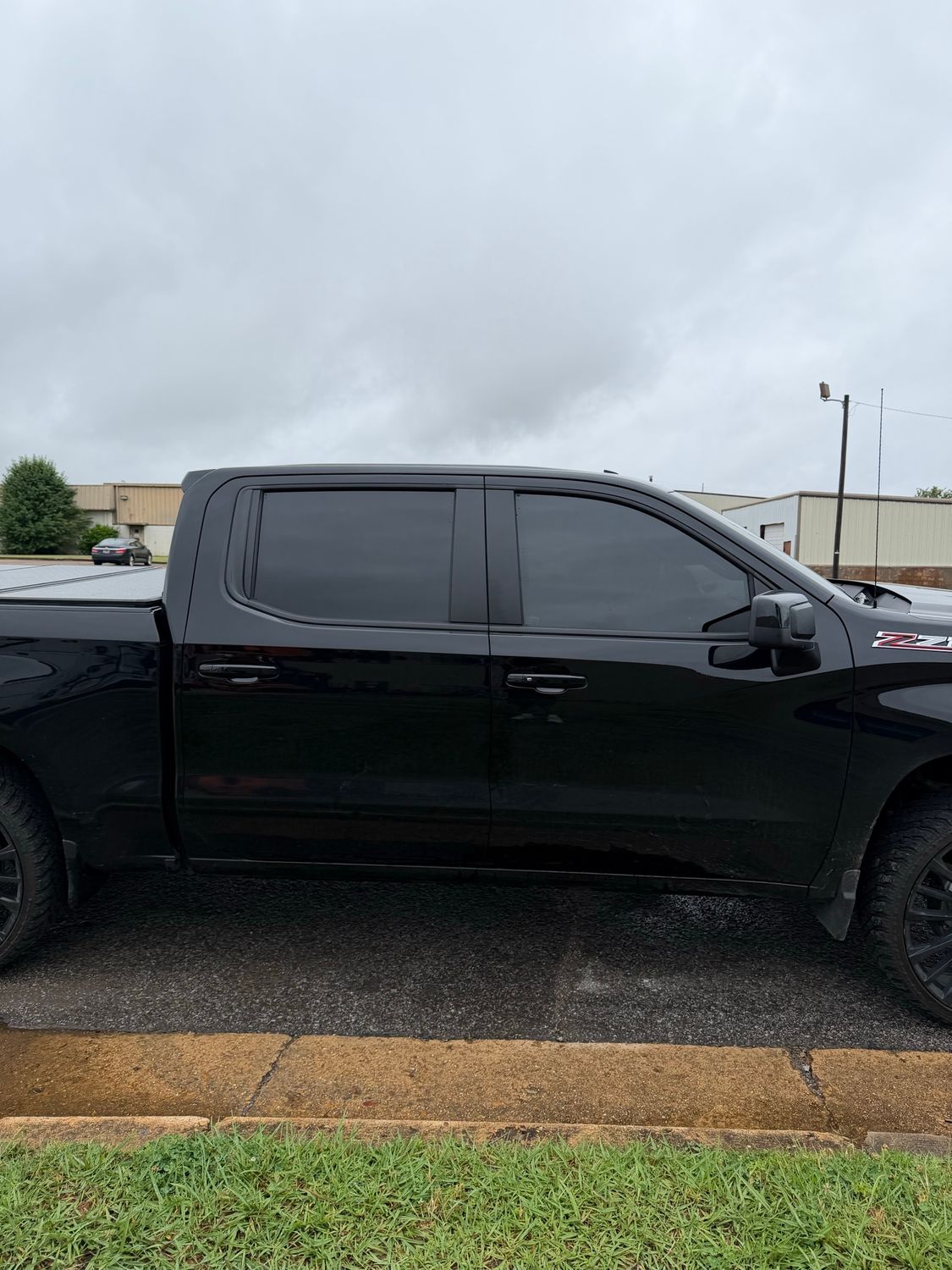 Black Chevrolet Silverado before the Southern American Remodeling graphics