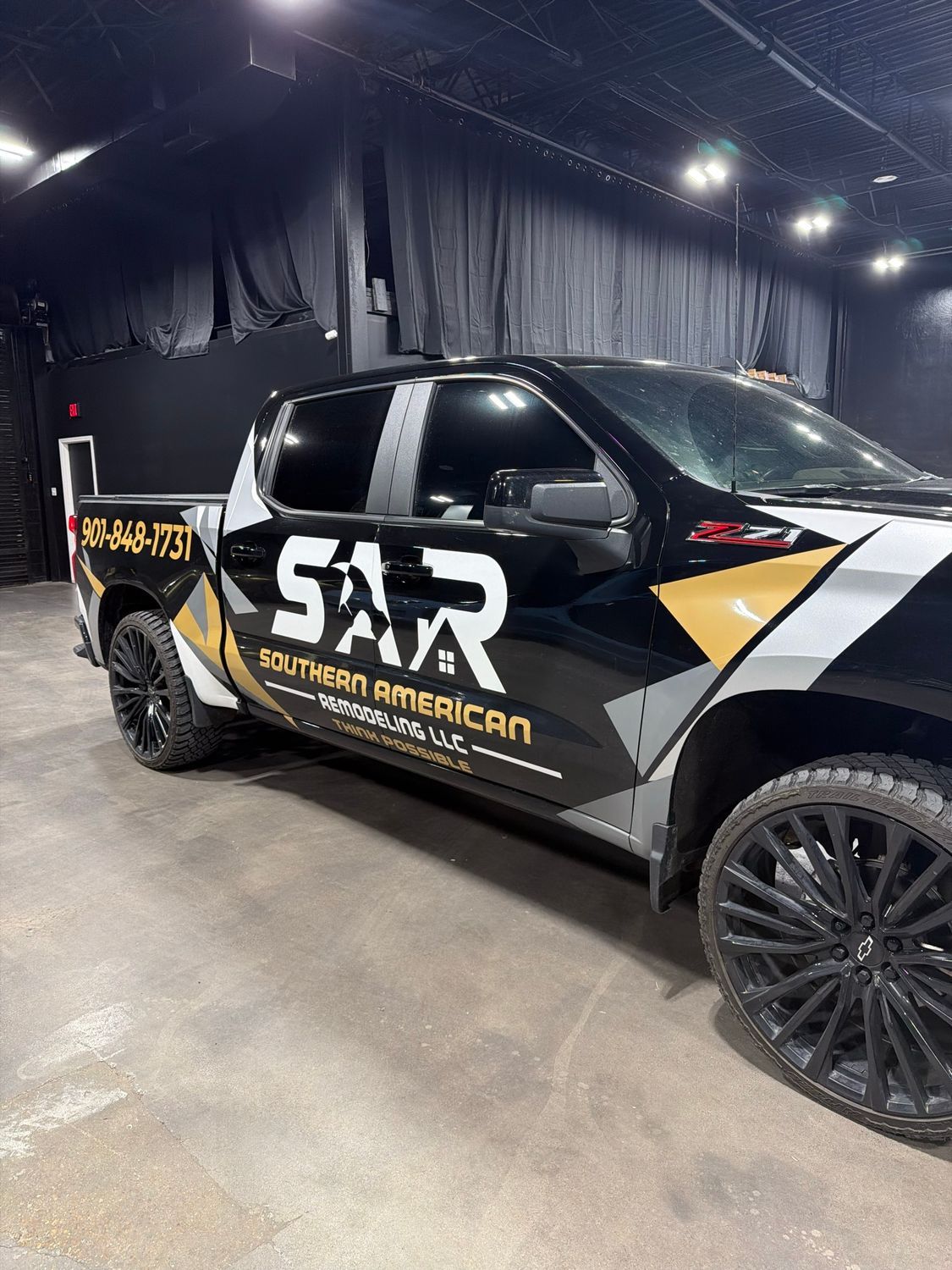 Southern American Remodeling Chevrolet Silverado with custom cut wrap graphics by Eye Kandy Customs