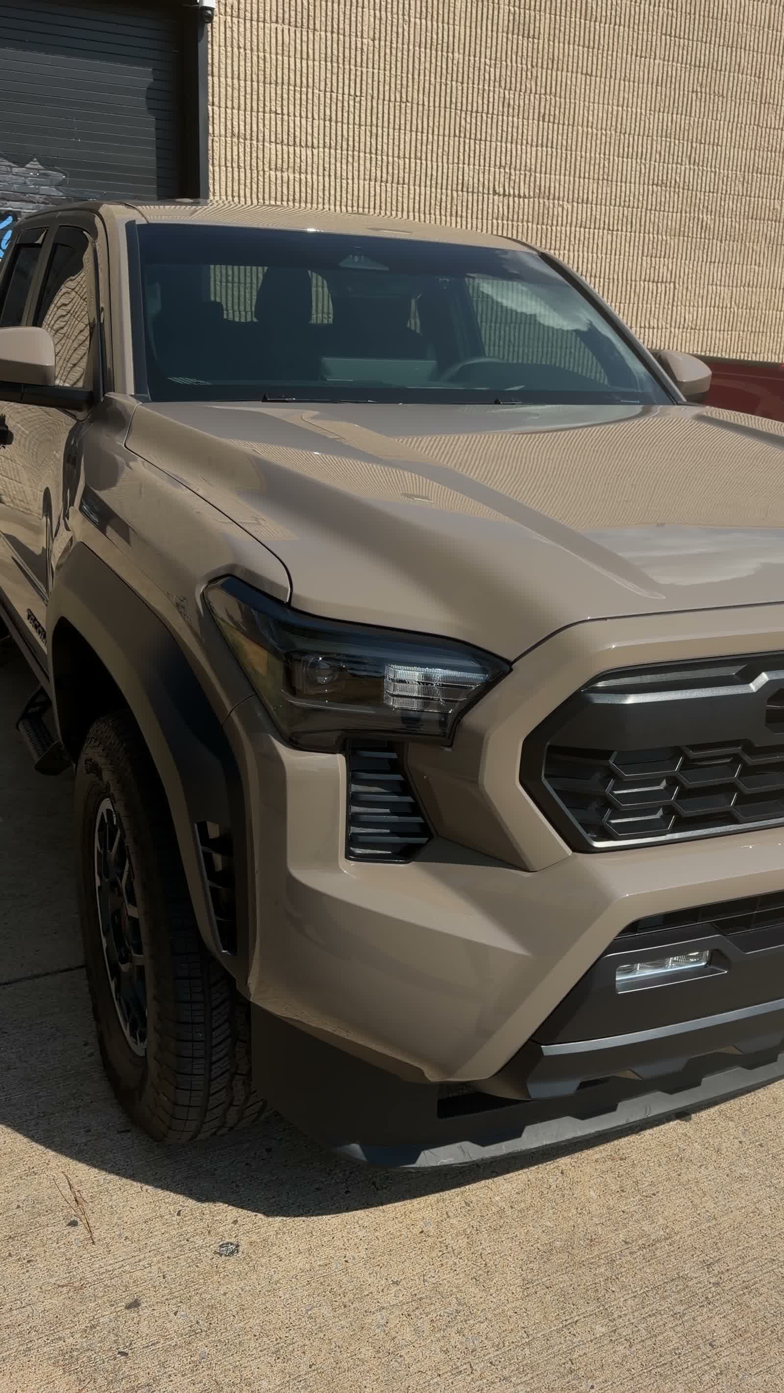 Close view of the Tacoma front end with clear paint protection film