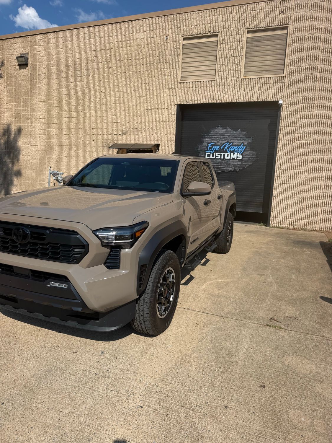 Tan Toyota Tacoma TRD with paint protection film at Eye Kandy Customs