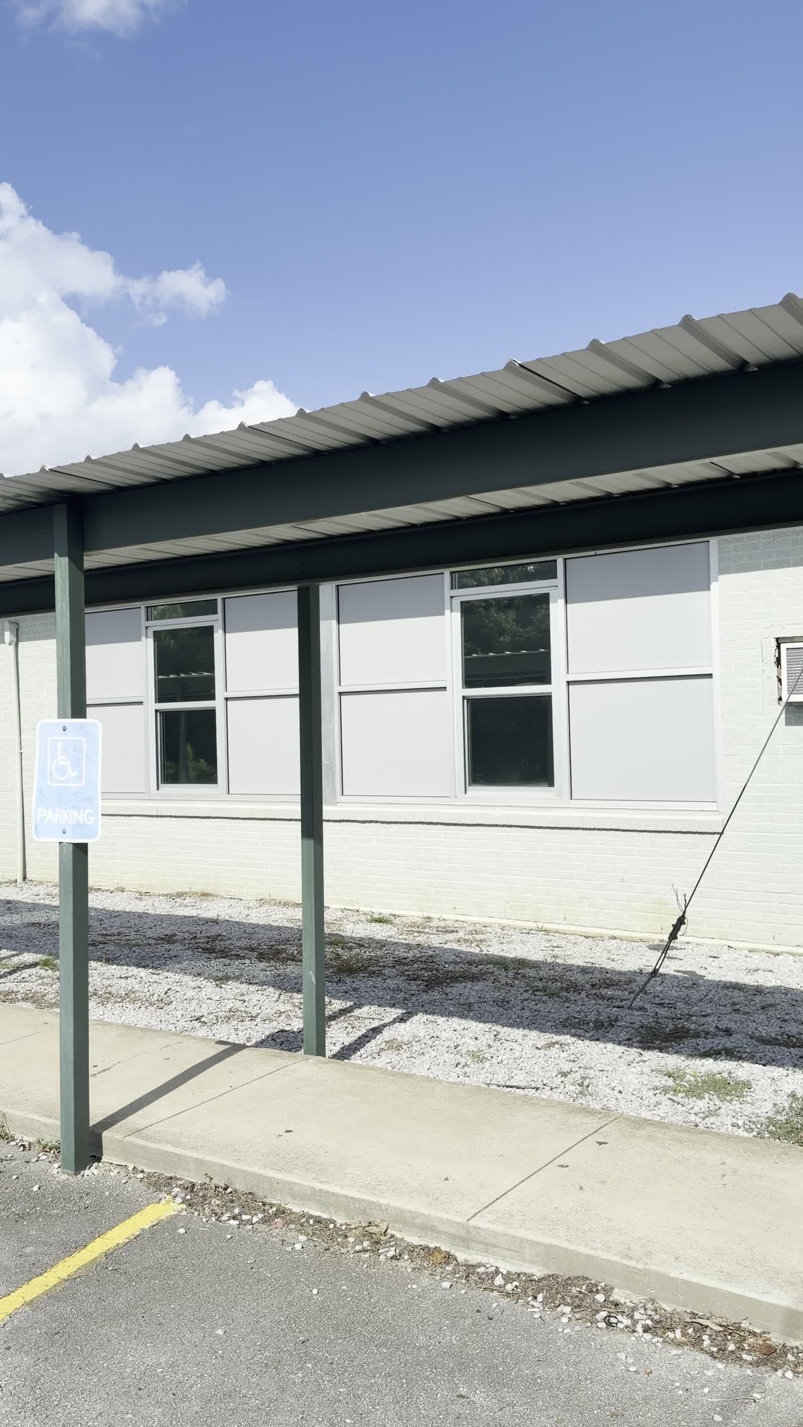 Tinted exterior windows under the covered walkway at H.W. Byers School