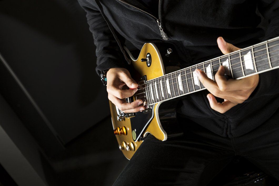 musician hands playing guitar
