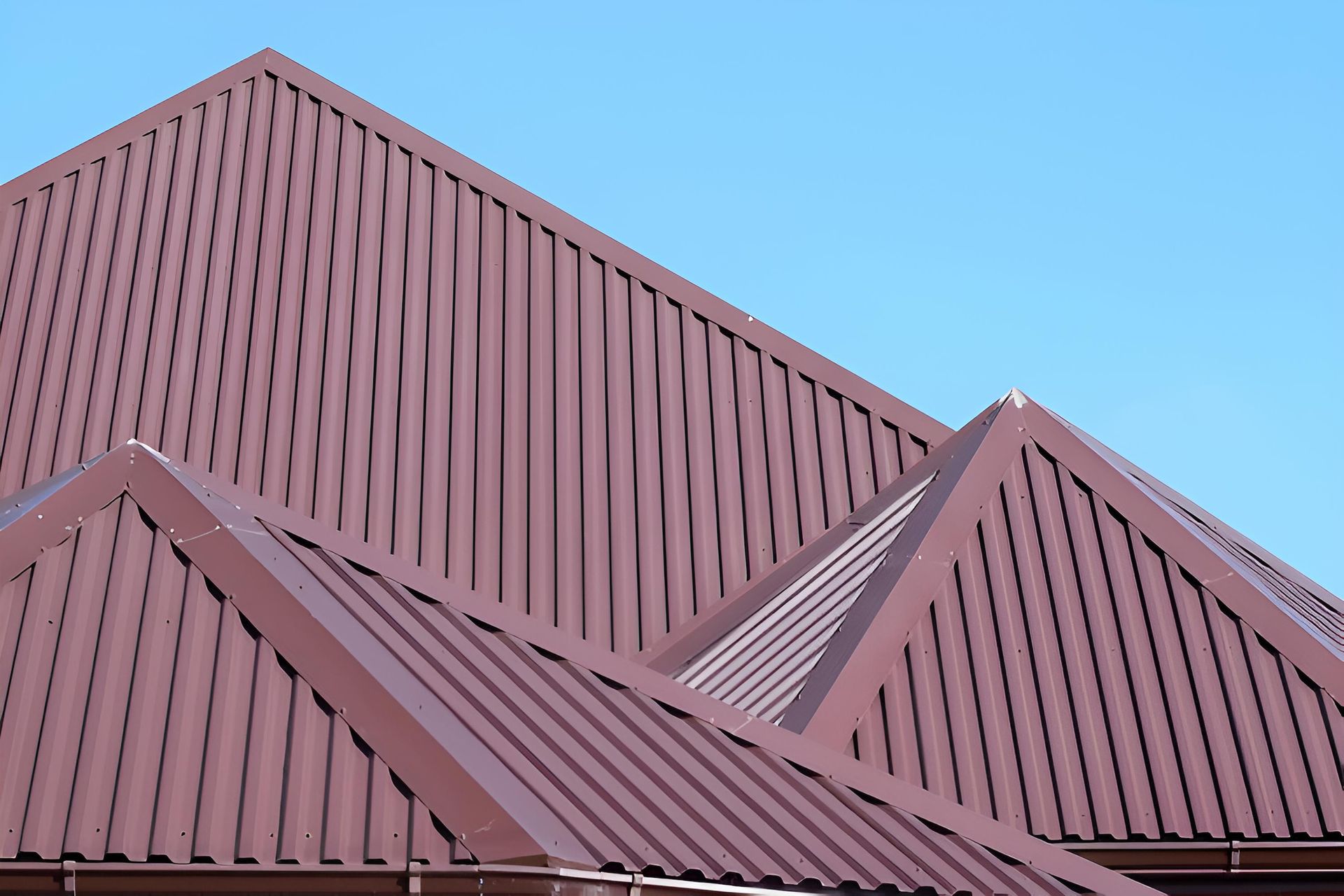 A Brown Roof With a Blue Sky in the Background — Ron Nickel Roofing in Nerang, QLD