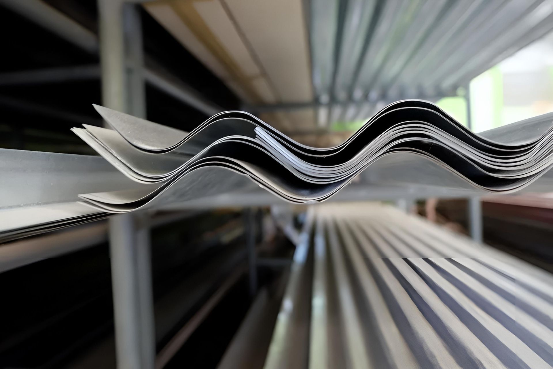 A Bunch of Corrugated Metal Sheets Stacked on Top of Each Other — Ron Nickel Roofing in Nerang, QLD