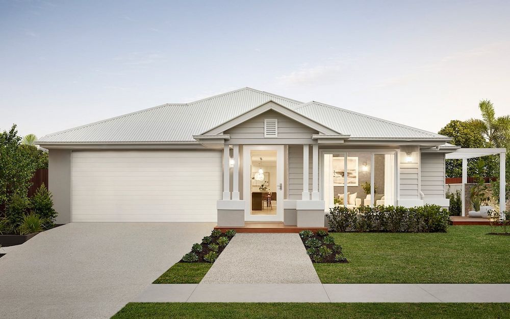 A White House With a White Roof and a White Garage Door — Ron Nickel Roofing in Tweed Heads, NSW
