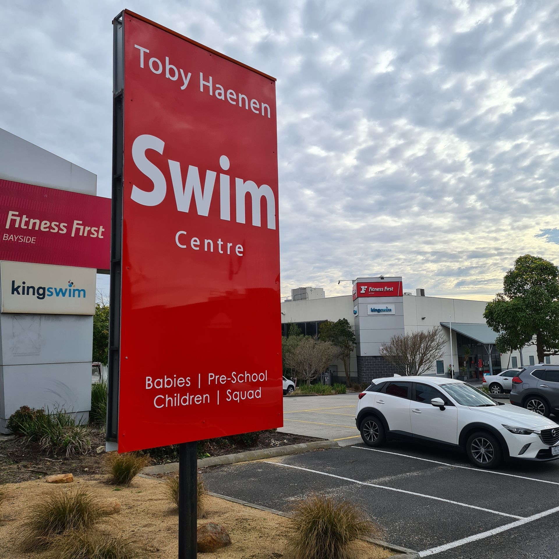 A red sign for the toby haenen swim centre