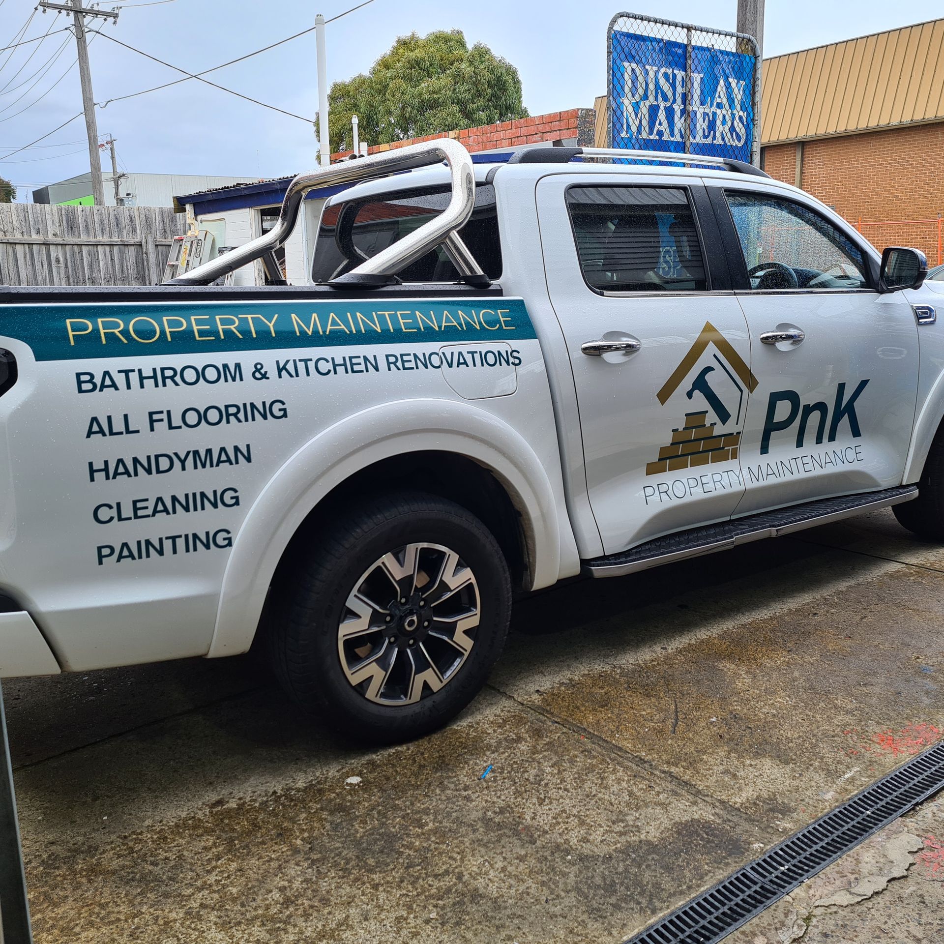 A white truck with the word pnk on the side