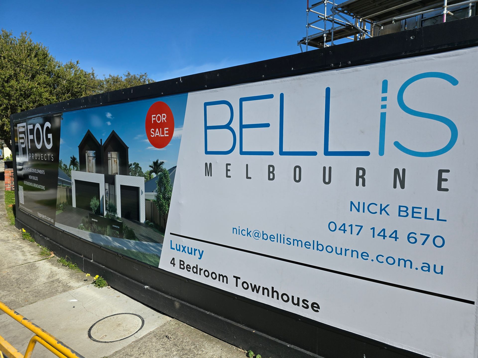 A billboard for bellis melbourne with a picture of a house on it