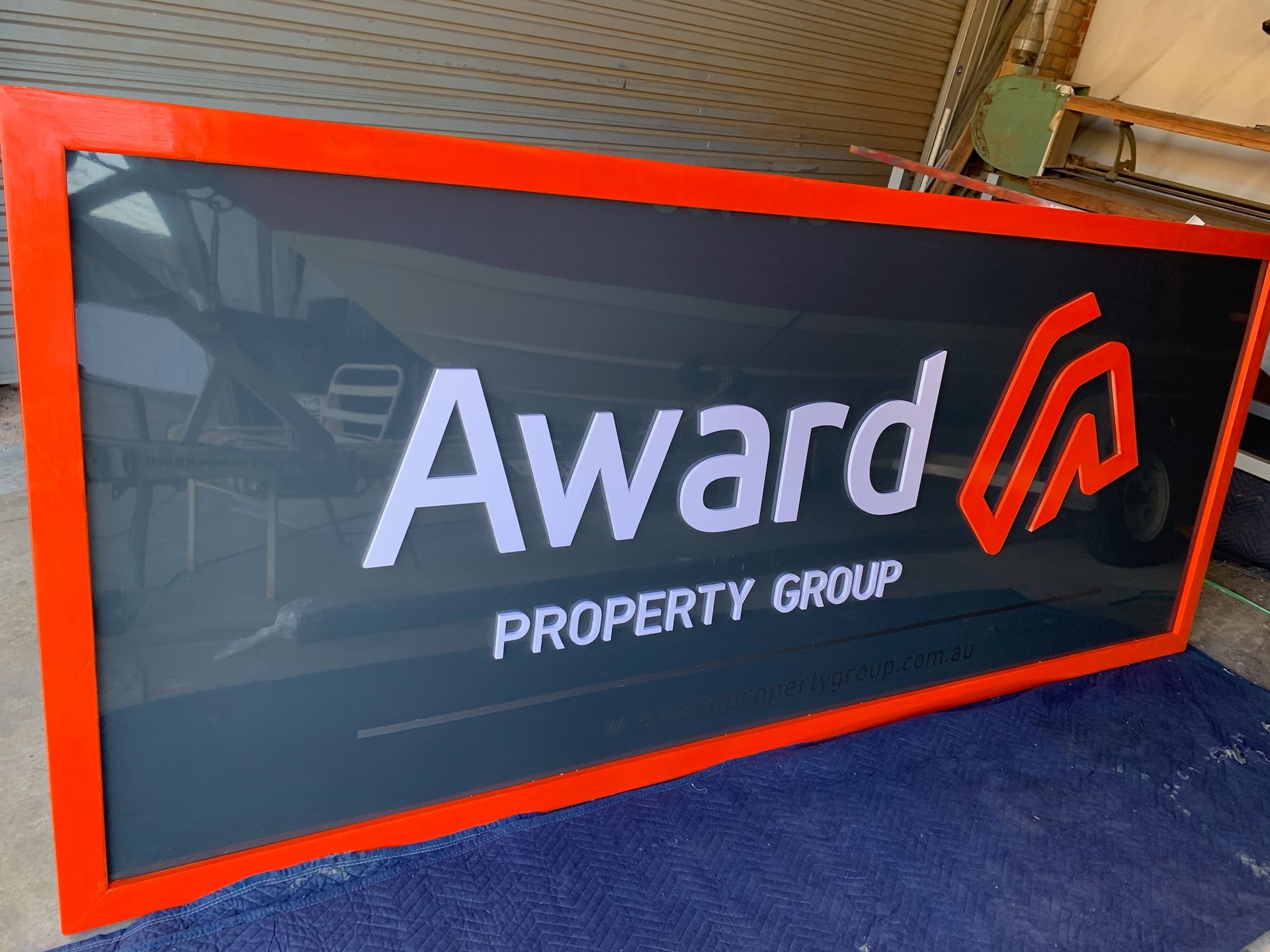 A sign that says award property group on it