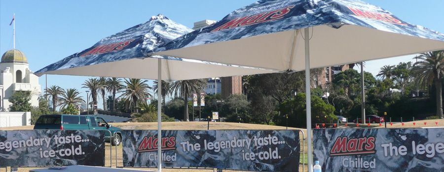 A tent with a sign that says the legendary taste of ice cold