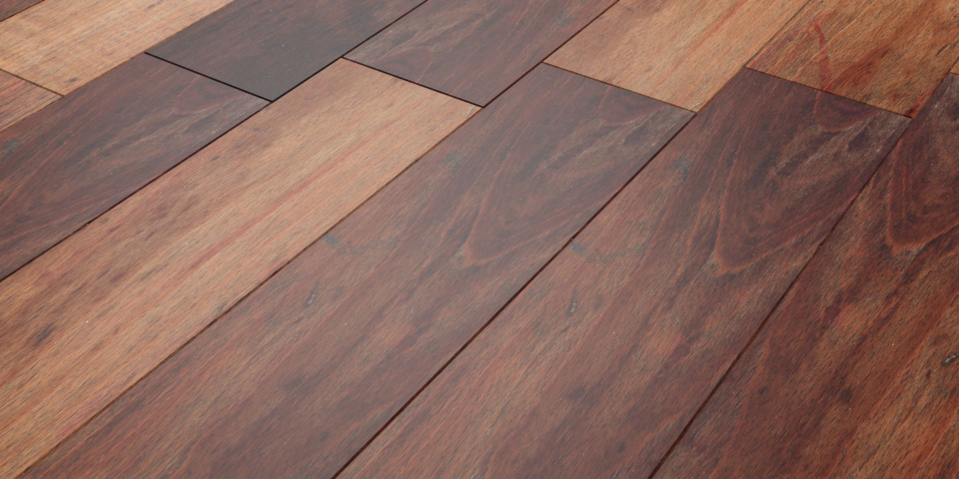 A close up of a wooden floor with a striped pattern.