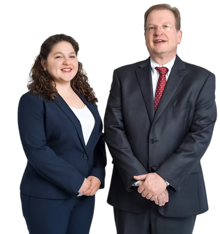 Two people in business suits standing against a white background, smiling at the camera.