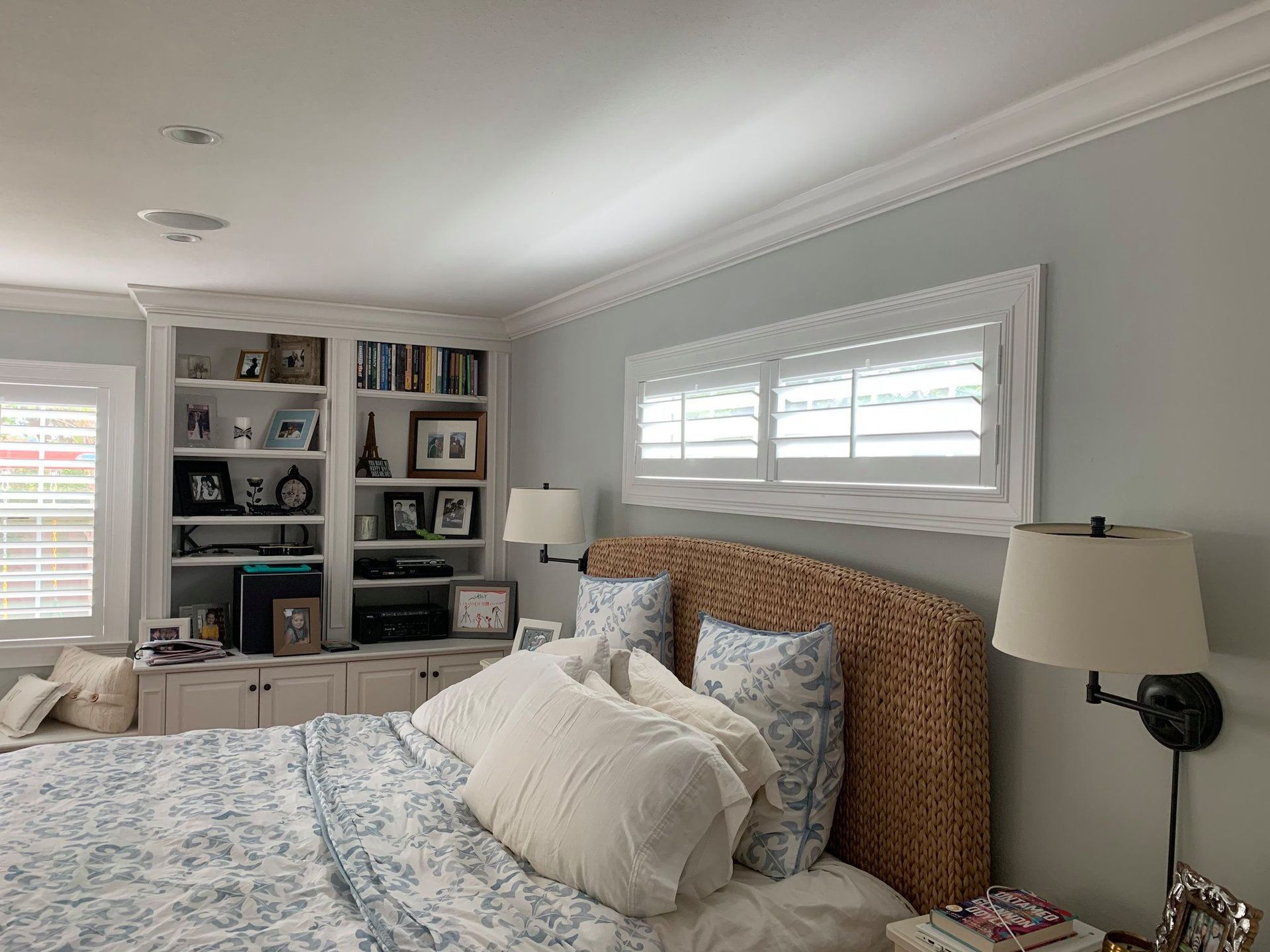 Bedroom With White Shutters.