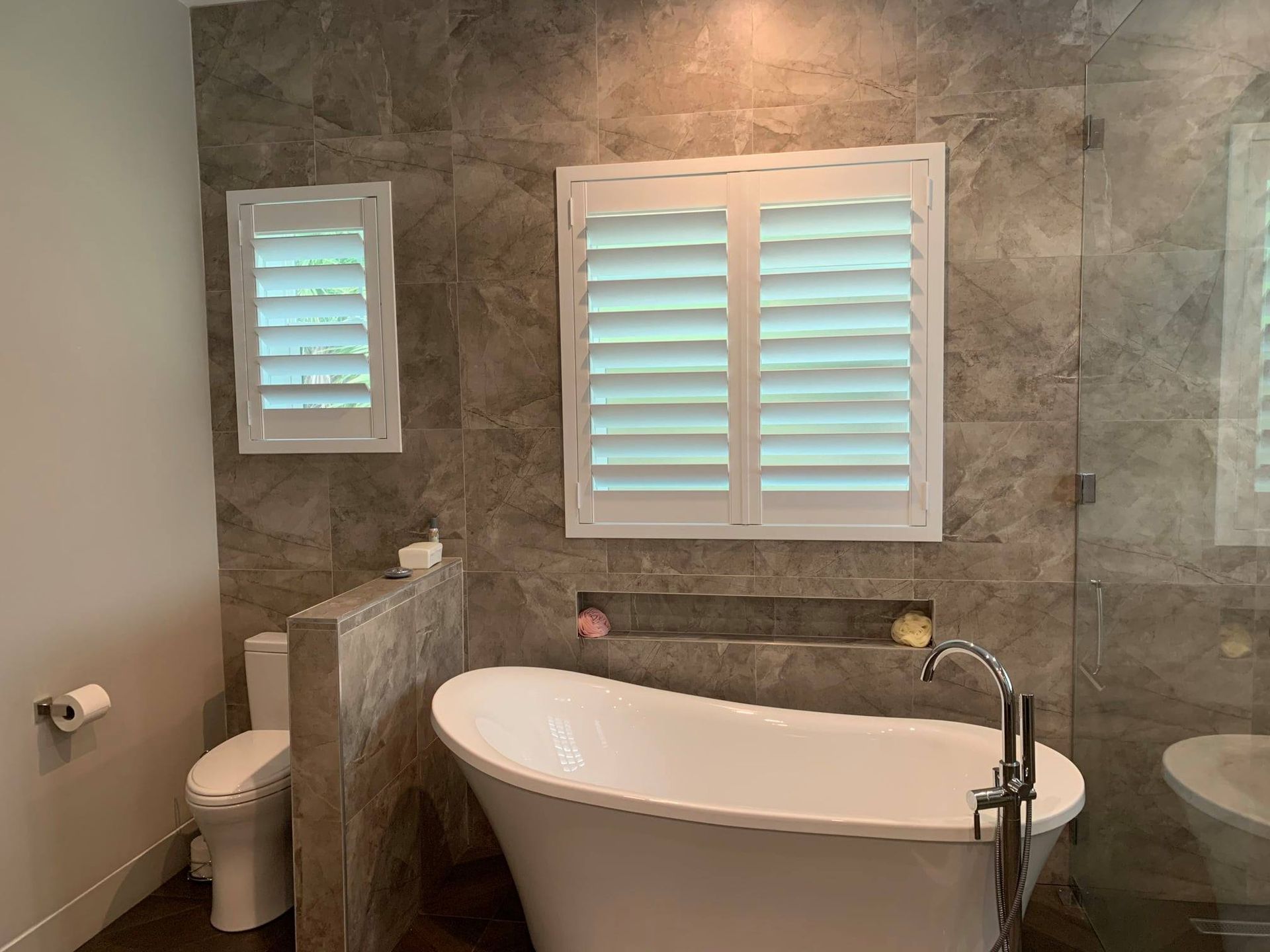 Bathroom With Bathtub And Shutters.