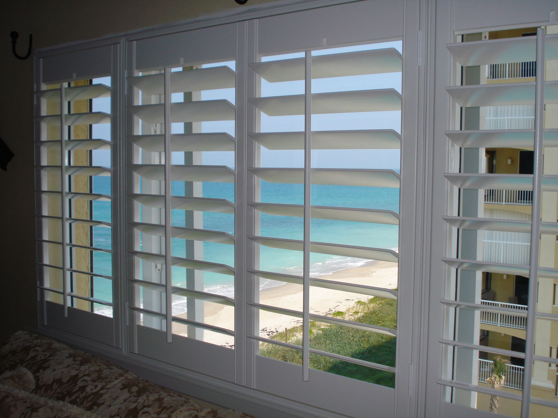 Close-up of an open window with shutters. Close-up of an open window with shutters.