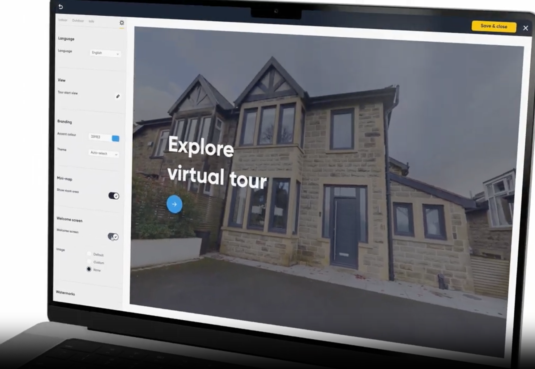 Laptop displaying a virtual tour of a stone house, with interactive buttons for navigation.