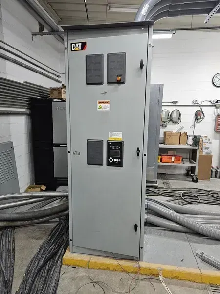 Gray Cat electrical control panel in a factory setting.