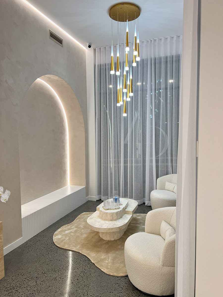 A Modern Room With White Chairs — JMB Electrical Services In Port Kembla, NSW