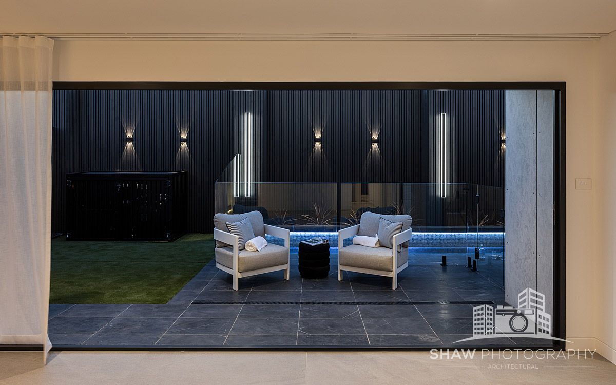 Two Chairs Are Sitting on a Patio — JMB Electrical Services In Port Kembla, NSW