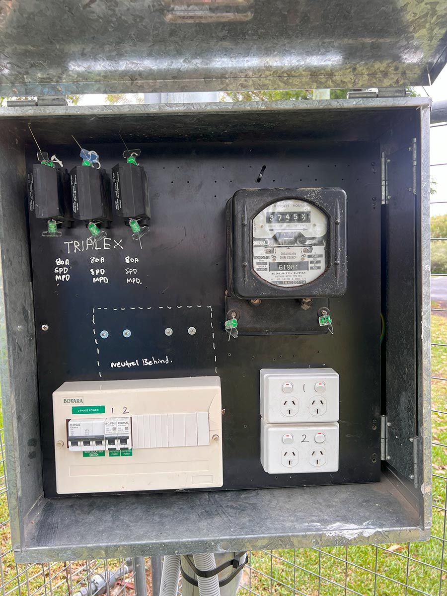 Open Metal Electrical Box Containing a Meter, Circuit Breakers, and Outlets — JMB Electrical Services In Port Kembla, NSW