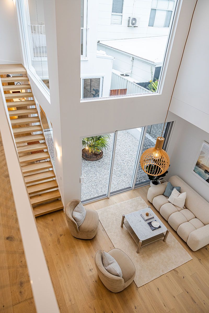 Living Room With High Ceilings and Large Windows — JMB Electrical Services In Port Kembla, NSW