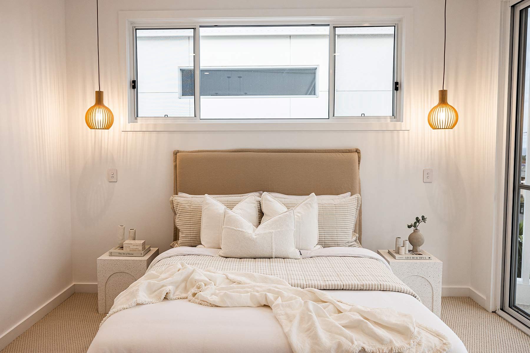 Bedroom With a Beige Upholstered Bed — JMB Electrical Services In Port Kembla, NSW