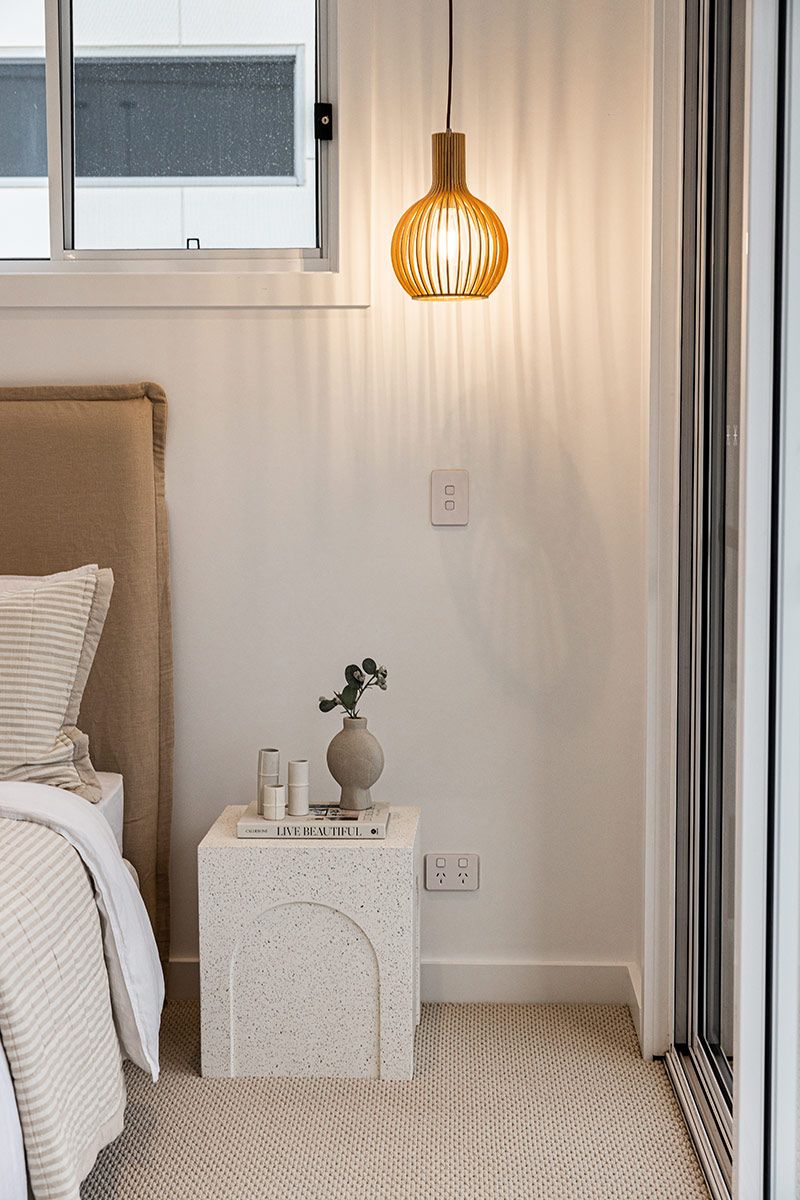 Bedside Table Holding a Vase and Books — JMB Electrical Services In Port Kembla, NSW