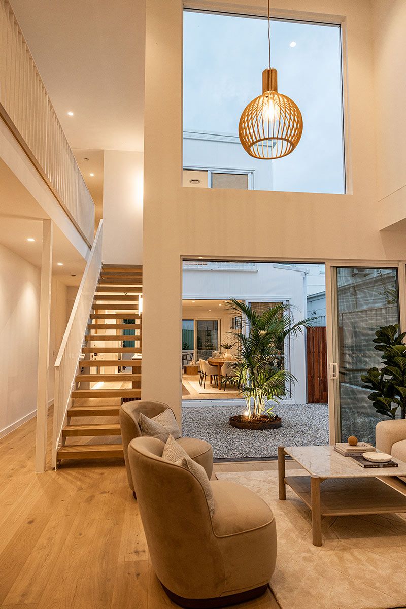A Living Room With a Staircase — JMB Electrical Services In Port Kembla, NSW