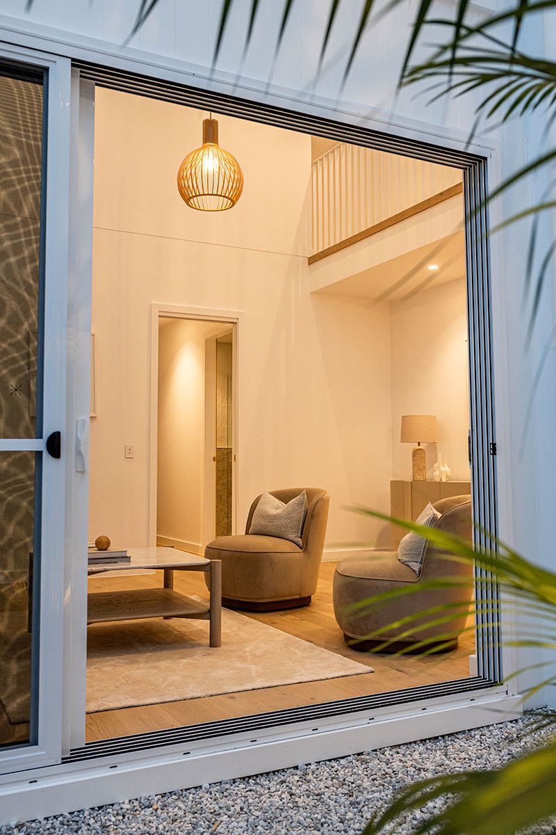 A Living Room With a Sliding Glass Door — JMB Electrical Services In Port Kembla, NSW