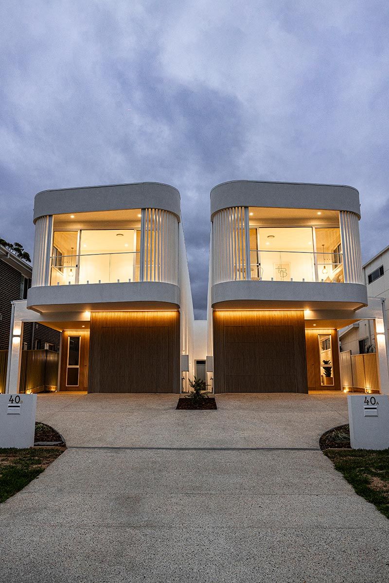 Modern Duplex With Rounded Upper Floors and Large Windows — JMB Electrical Services In Port Kembla, NSW