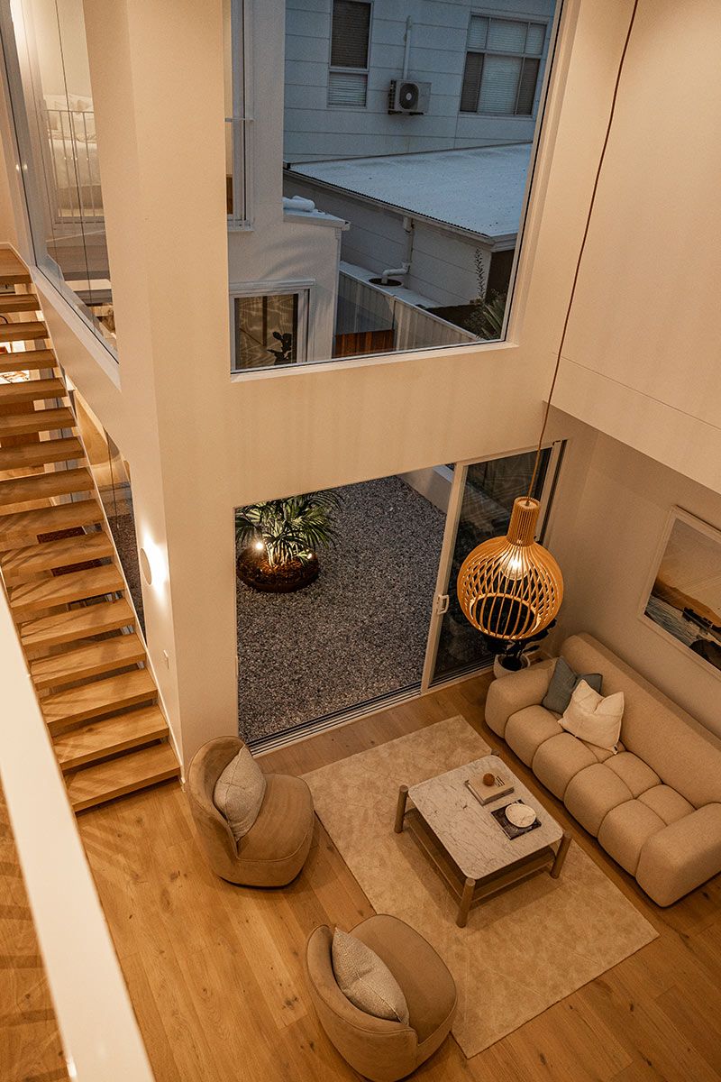 Living Room With Beige Sofas and a Marble Coffee Table — JMB Electrical Services In Port Kembla, NSW