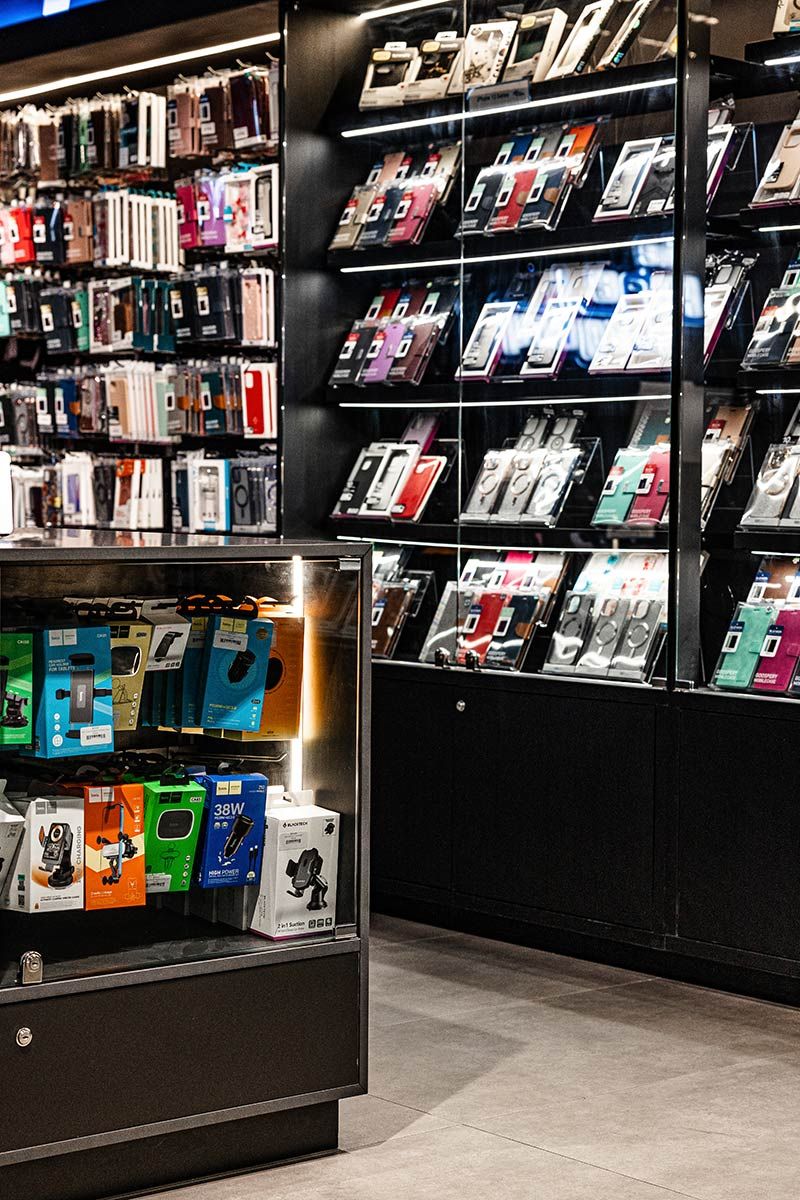 Shelves Filled With Colourful Smartphone Cases — JMB Electrical Services In Port Kembla, NSW