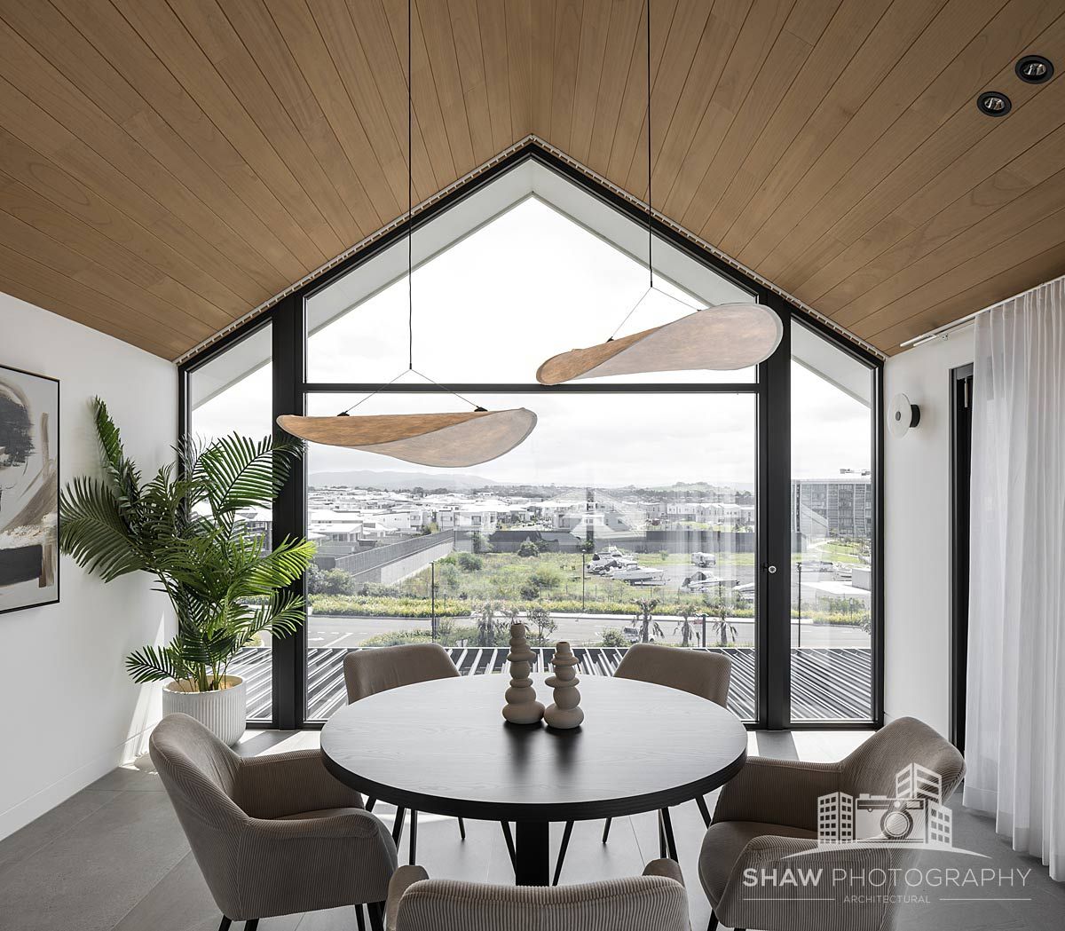 A Dining Room With a Round Table and Chairs — JMB Electrical Services In Port Kembla, NSW 