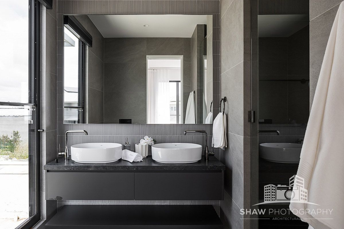 A Bathroom With Two Sinks and a Large Mirror — JMB Electrical Services In Port Kembla, NSW