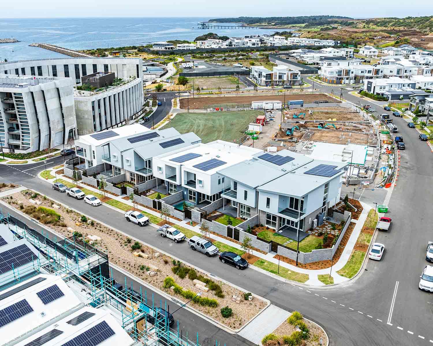 Modern White Houses With Solar Panels — JMB Electrical Services In Port Kembla, NSW