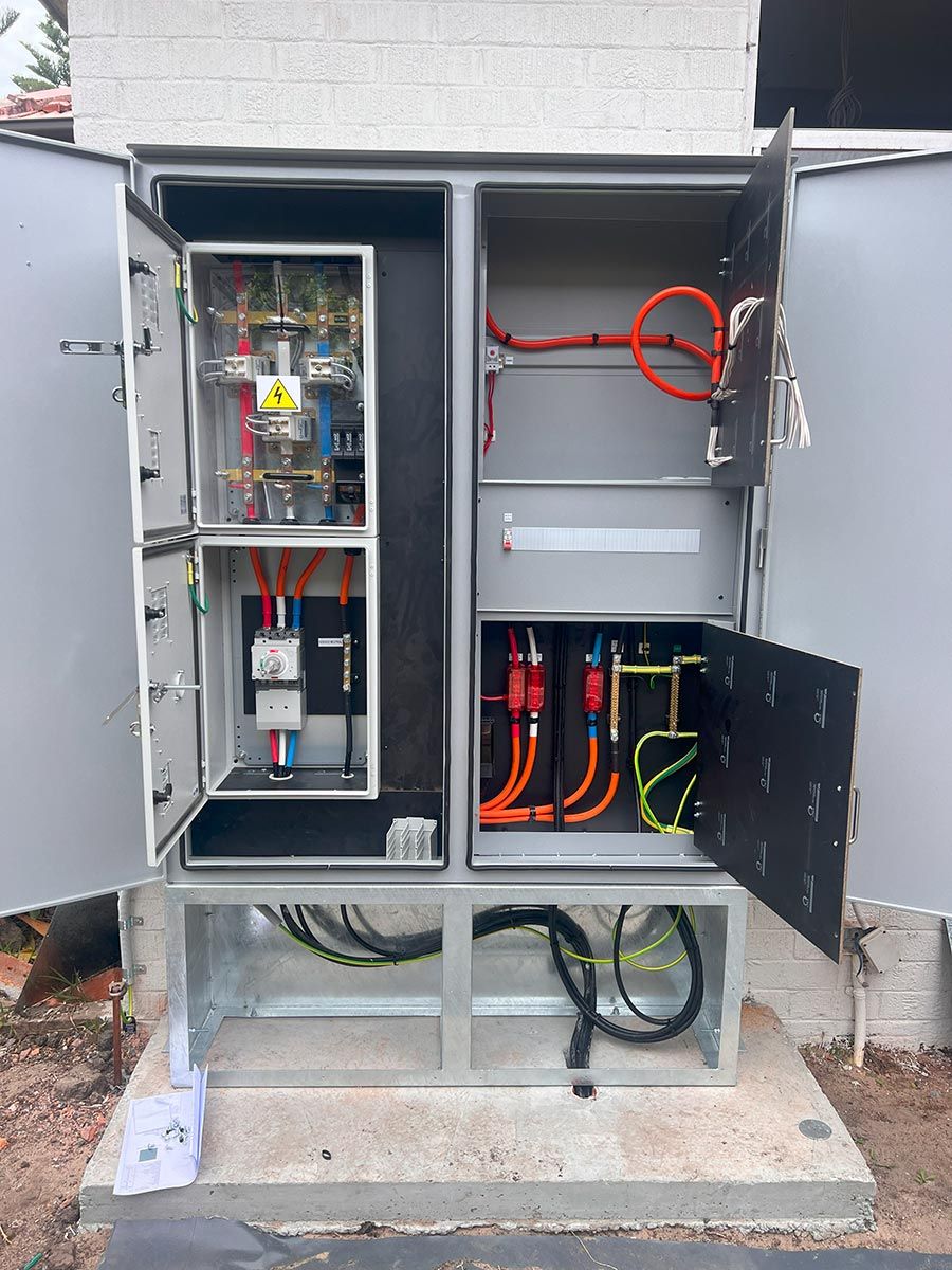 An Electrical Panel With Neatly Organised Coloured Wires — JMB Electrical Services In Port Kembla, NSW