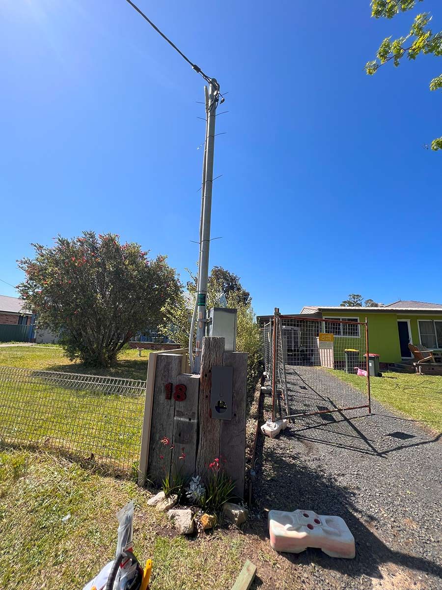 A Tall Pole and a Green House — JMB Electrical Services In Port Kembla, NSW